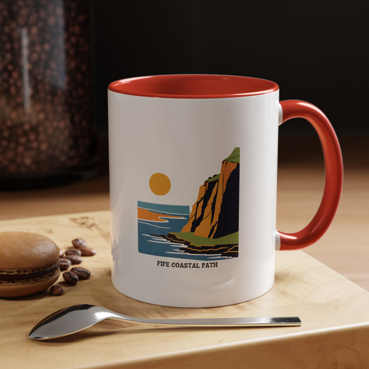 Vibrant Fife Coastal Path mug designed with intricate illustrations of Scotland’s coastal trail. Durable and microwave-safe, it is ideal for daily use or as a souvenir. A perfect addition to any collection.