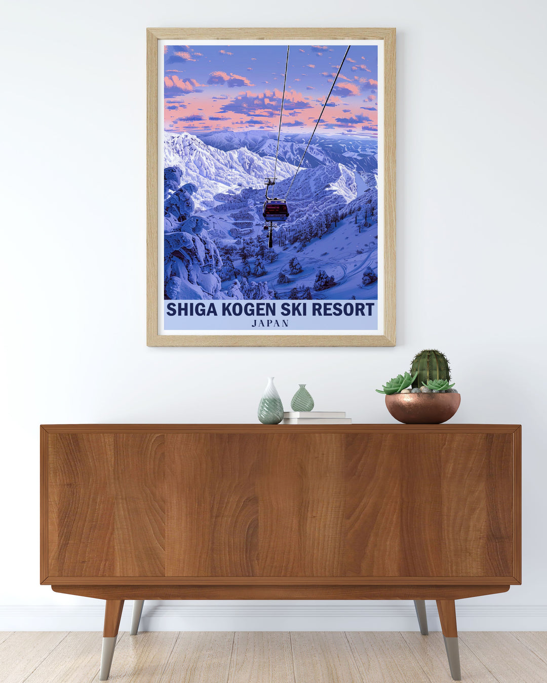 This Shiga Kogen Ski Resort poster captures the pristine beauty of one of Japans top ski destinations. With the towering Japanese Alps in the background, this vintage style print highlights the snow covered peaks and tranquil atmosphere, perfect for any ski enthusiast or lover of Japans winter landscapes.