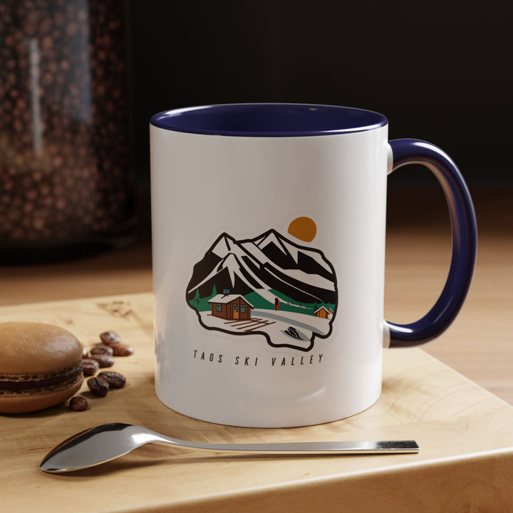 A premium Taos Ski Valley Mug displaying the region's scenic landscapes in vibrant detail. Made from durable ceramic, dishwasher and microwave safe, combining practicality with artistic expression for everyday enjoyment.