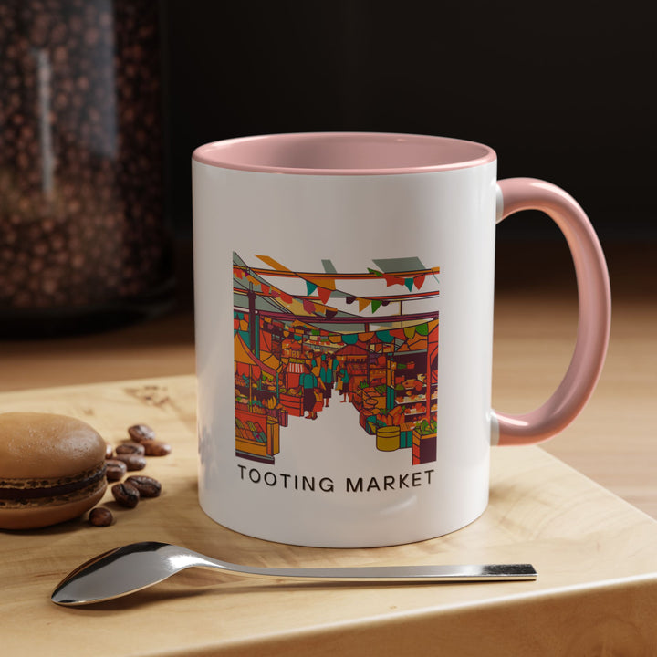 This Tooting Market mug combines practicality with artistic flair, displaying detailed artwork of the markets lively atmosphere. Made from high-quality ceramic, dishwasher and microwave safe, ideal for daily use or as a special keepsake for those who love cultural experiences.