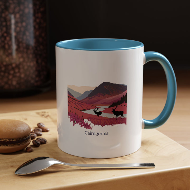 The Cairngorms Scotland Mug is a vibrant ceramic cup featuring artistic designs inspired by the natural wonders of Scotland. Dishwasher safe and durable, it is perfect for daily coffee rituals or as a unique keepsake for art and travel lovers.