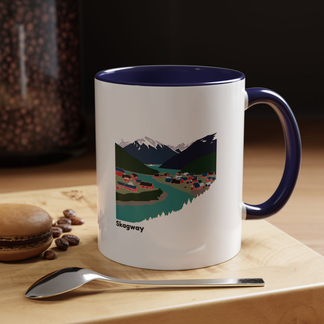 The Skagway Alaska Mug combines functionality with scenic artwork, highlighting the beauty of Alaska. Perfect for coffee or tea lovers, this ceramic mug is dishwasher-safe and a great keepsake for travelers.