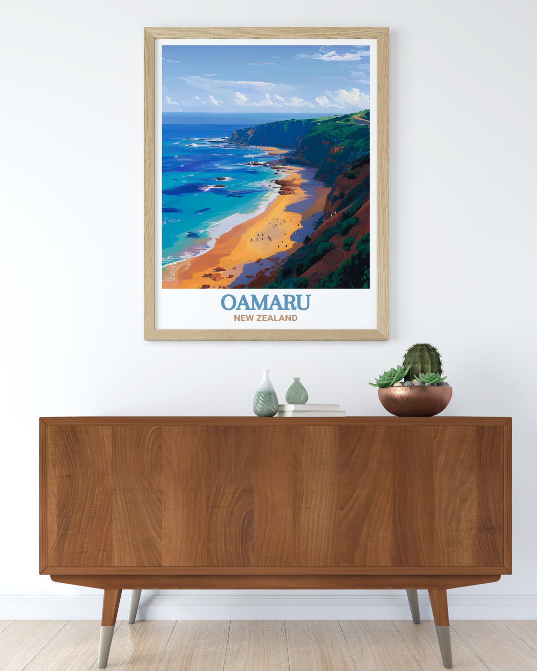 Oamaru Framed Art highlighting the coastal charm of Bushy Beach, with its golden sands and vibrant blue sea. This framed art piece captures the unique allure of New Zealands hidden treasures, perfect for adding a touch of nature to your decor.