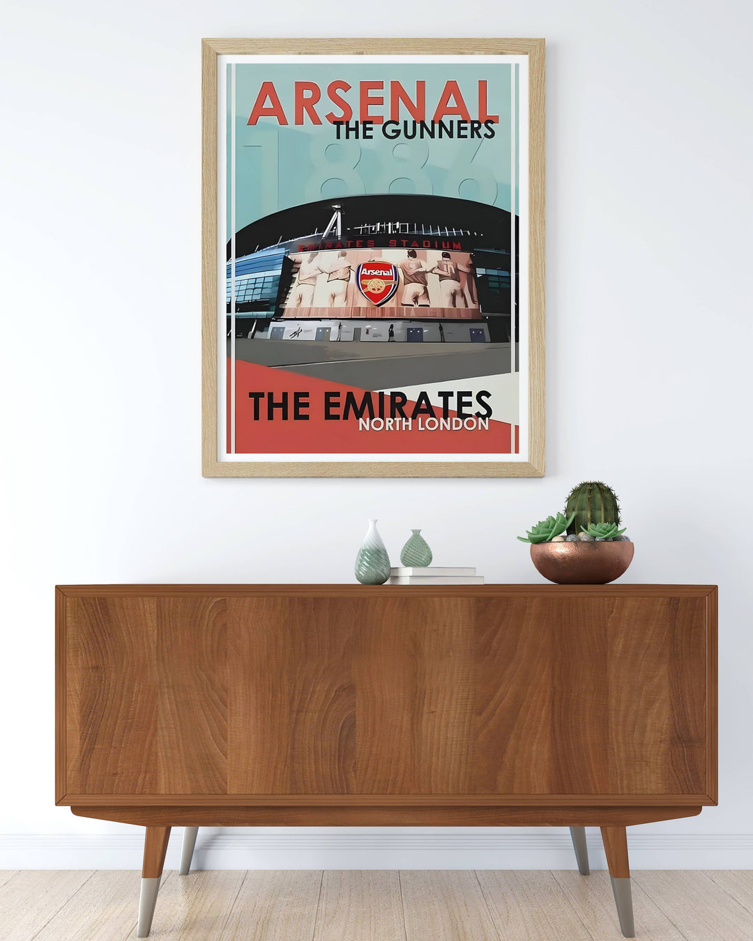 Arsenal FC stadium poster showing the Emirates in North London with its distinctive facade and crest mural, marking the club&