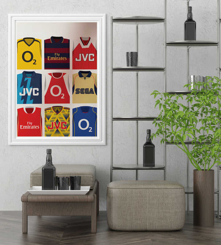 Football wall art print featuring nine iconic Arsenal FC shirts, including O2 and Fly Emirates sponsor kits worn by the North London club, available as a canvas, framed, or unframed print.