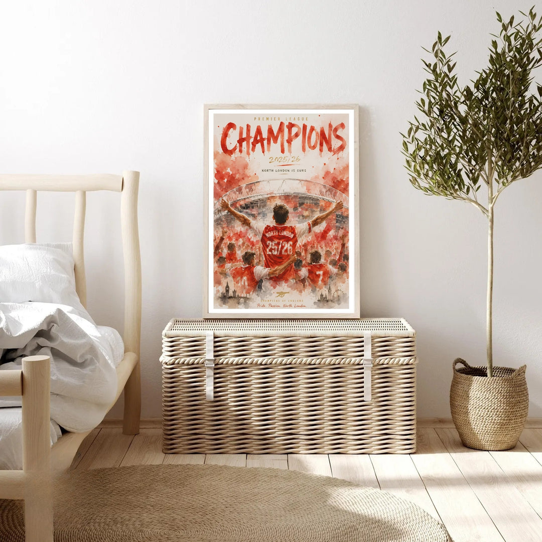 Arsenal Champions 2025/26 poster depicting a player lifted by teammates in front of the Emirates Stadium, with "Champions of England" and "Pride. Passion. North London." lettering, available framed, unframed, or on canvas.