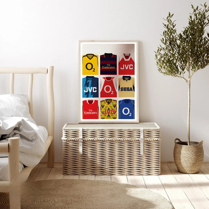 Arsenal FC nostalgia poster featuring nine classic shirts, from the red home kit to the JVC yellow-and-navy away strip, a tribute to the North London club&