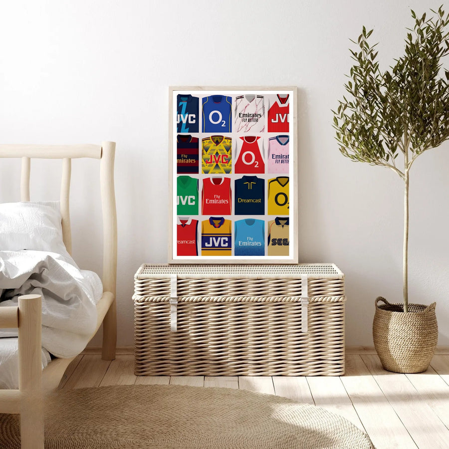 Illustrated Arsenal FC kit grid poster showing sponsor jerseys including O2, Fly Emirates, JVC, Dreamcast, and Sega, worn by the North London club across different eras, available as canvas, framed, or unframed wall art.