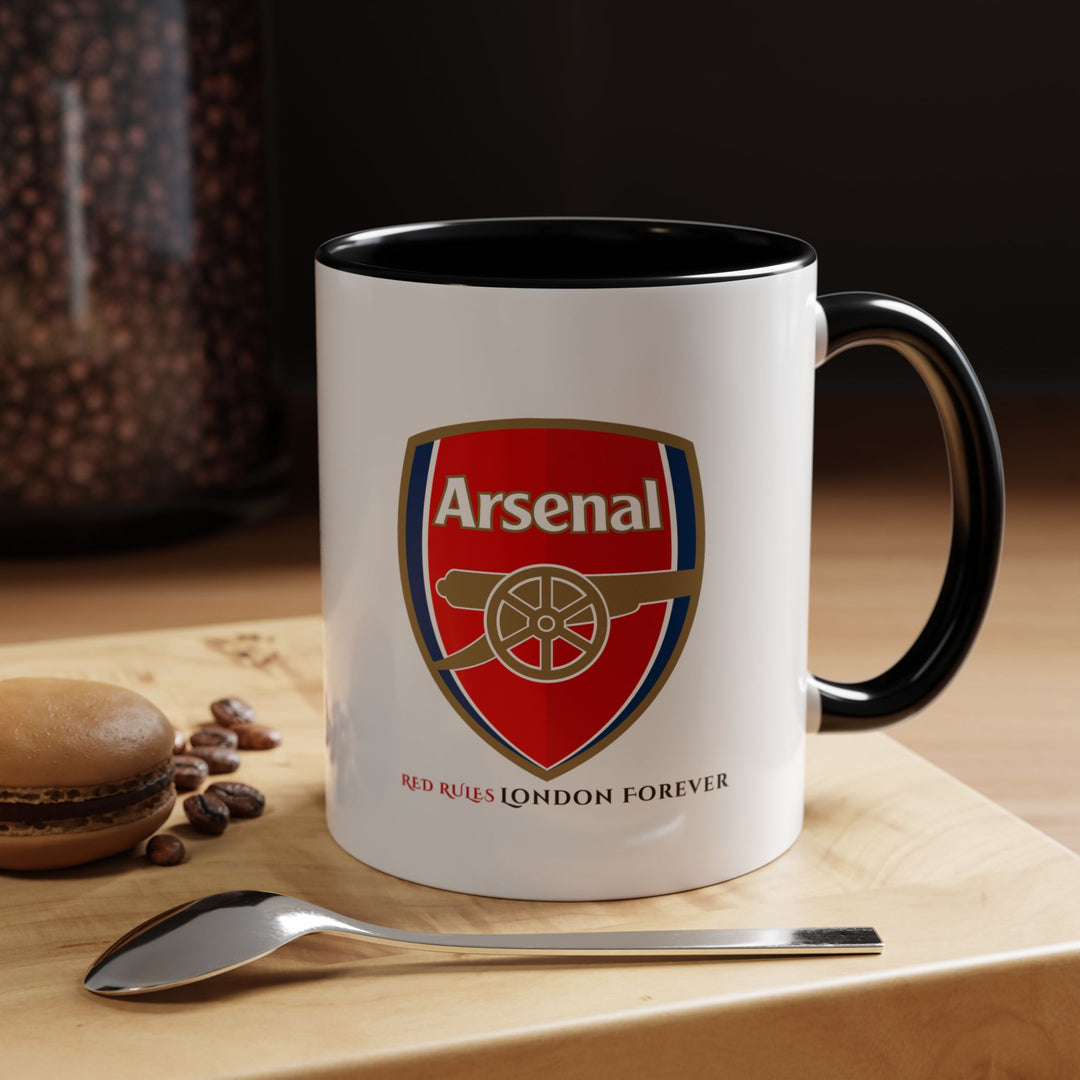 Black Arsenal ceramic mug with official Arsenal logo and stadium artwork. Stylish and timeless supporter drinkware for coffee and tea lovers. Perfect for gifting to Arsenal fans, decorating fan spaces, or everyday use. Produced by Map Your Dreams to celebrate club loyalty with elegance.