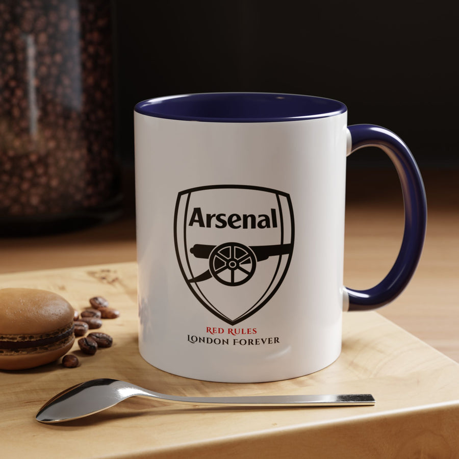 Navy blue Arsenal FC coffee and tea mug featuring official club crest on quality ceramic. A stylish and subtle supporter item for daily drinking or display. Comfortable handle and smooth finish. Ideal as a gift for fans or a personal collectible. Made by Map Your Dreams.