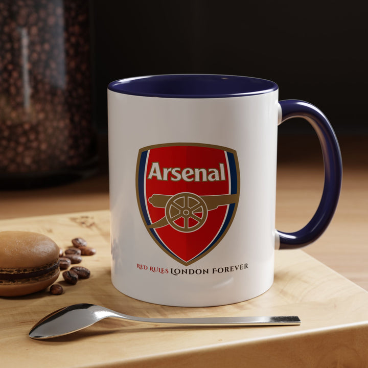 Navy blue Arsenal tea and coffee mug featuring the Arsenal logo and Emirates Stadium illustration. Sophisticated supporter drinkware suitable for fans who enjoy subtle yet expressive club merchandise. Great for home, office, gifting, and display. Designed by Map Your Dreams.