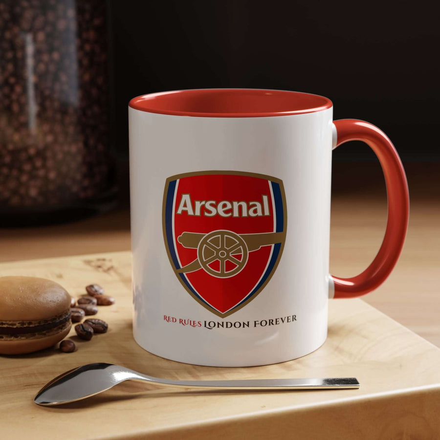 Red Arsenal coffee mug with the official Arsenal logo and Emirates Stadium artwork. A bold fan cup for tea, coffee, or display. Ideal for Arsenal supporters looking to show club pride daily. Durable ceramic drinkware created by Map Your Dreams, perfect for collections, gifting, office use, and match day excitement.