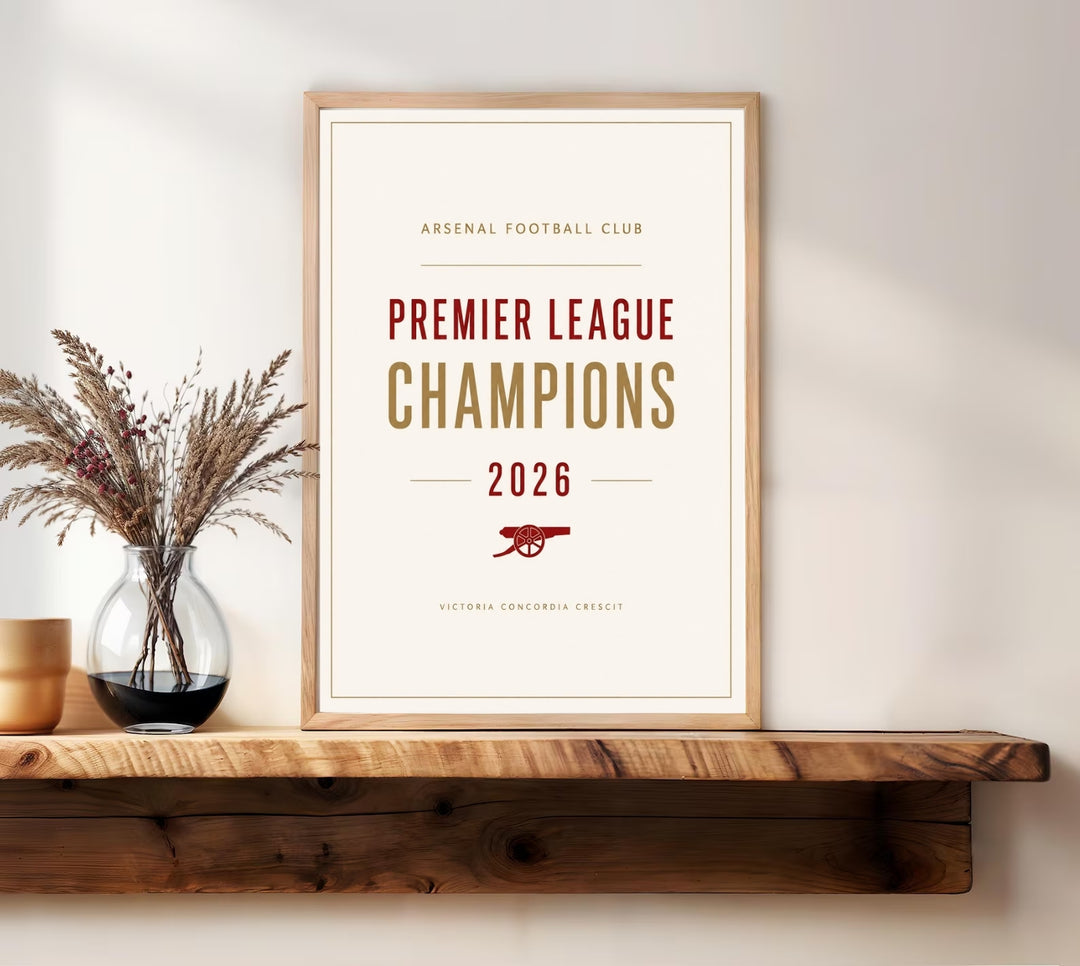 Minimalist Arsenal FC Premier League Champions 2026 art print featuring an elegant typography layout at Emirates Stadium in London, showcasing a clean cream background with red and gold lettering.