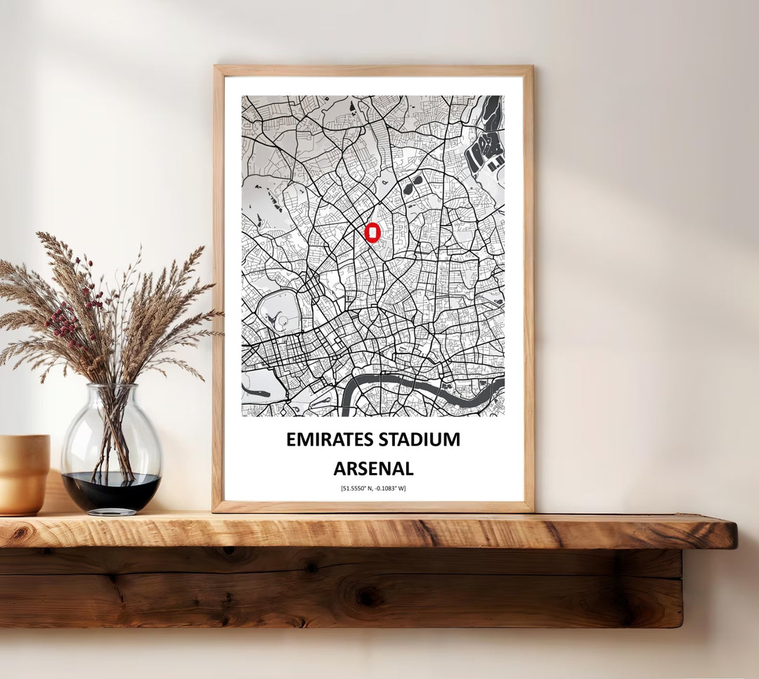 Monochrome map print pinpointing the Emirates Stadium within the North London street grid, showing the surrounding roads and a glimpse of the River Thames, offered as unframed, framed, or canvas wall art for Arsenal fans.