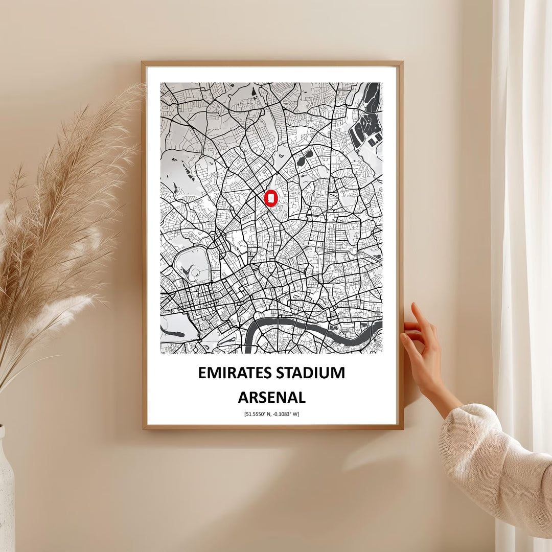 Print of the Emirates Stadium marked on a North London street map with a bold red pin, coordinates, and the surrounding neighborhood detail, offered unframed, on canvas, or framed for wall display.