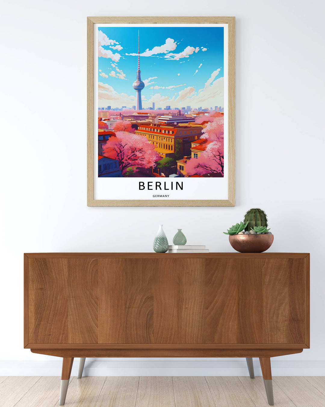An elegant framed Germany skyline poster blending warm orange rooftops, bright pink cherry blossoms, and a deep blue sky, creating a beautiful gift for travel and vector art lovers.