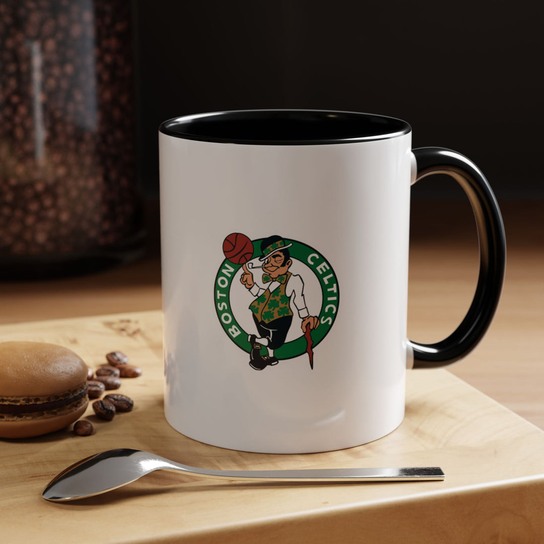 Black Boston Celtics ceramic mug with a sleek and modern design that combines style and durability. Ideal for coffee, tea, or hot chocolate, it’s perfect for fans looking for subtle, practical drinkware that showcases their NBA loyalty. Suitable for home, office, or gifting, this mug is a versatile addition to any Celtics fan collection.
