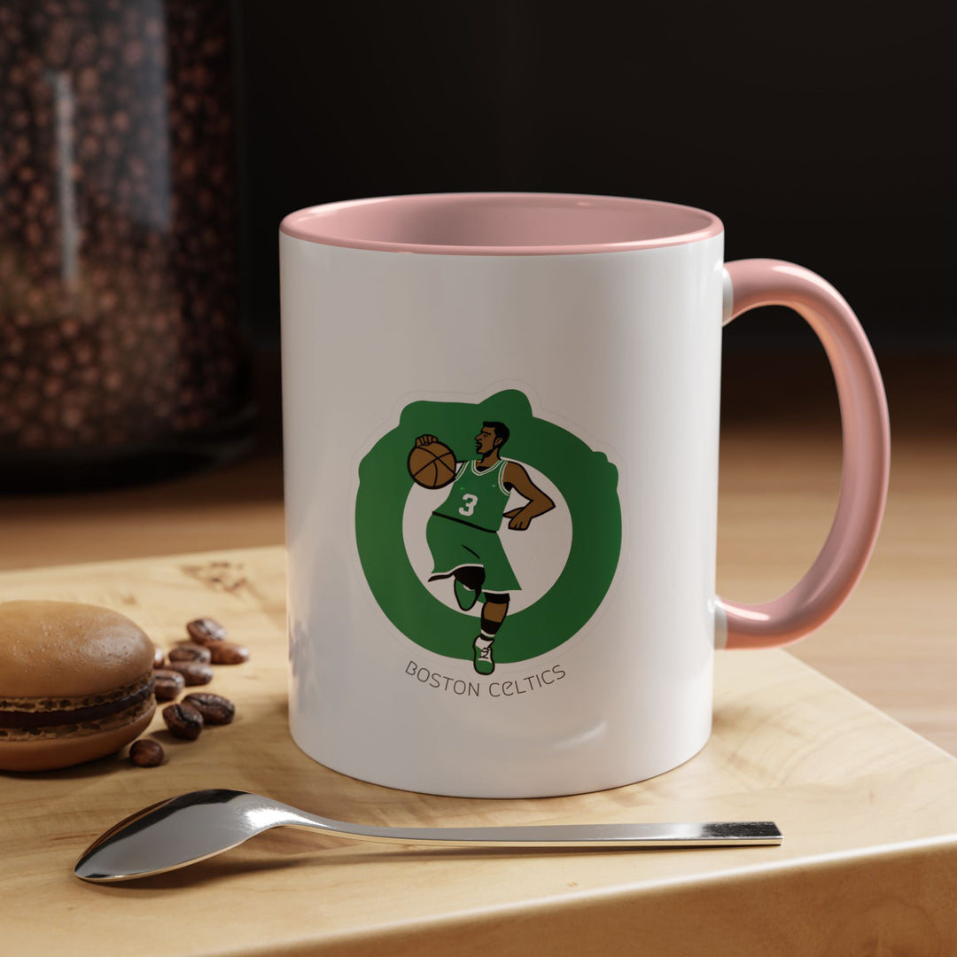 Pink Boston Celtics mug made of ceramic, perfect for enjoying hot beverages or displaying as part of a basketball fan collection. Designed for Celtics supporters seeking a playful and fun way to show team pride.
