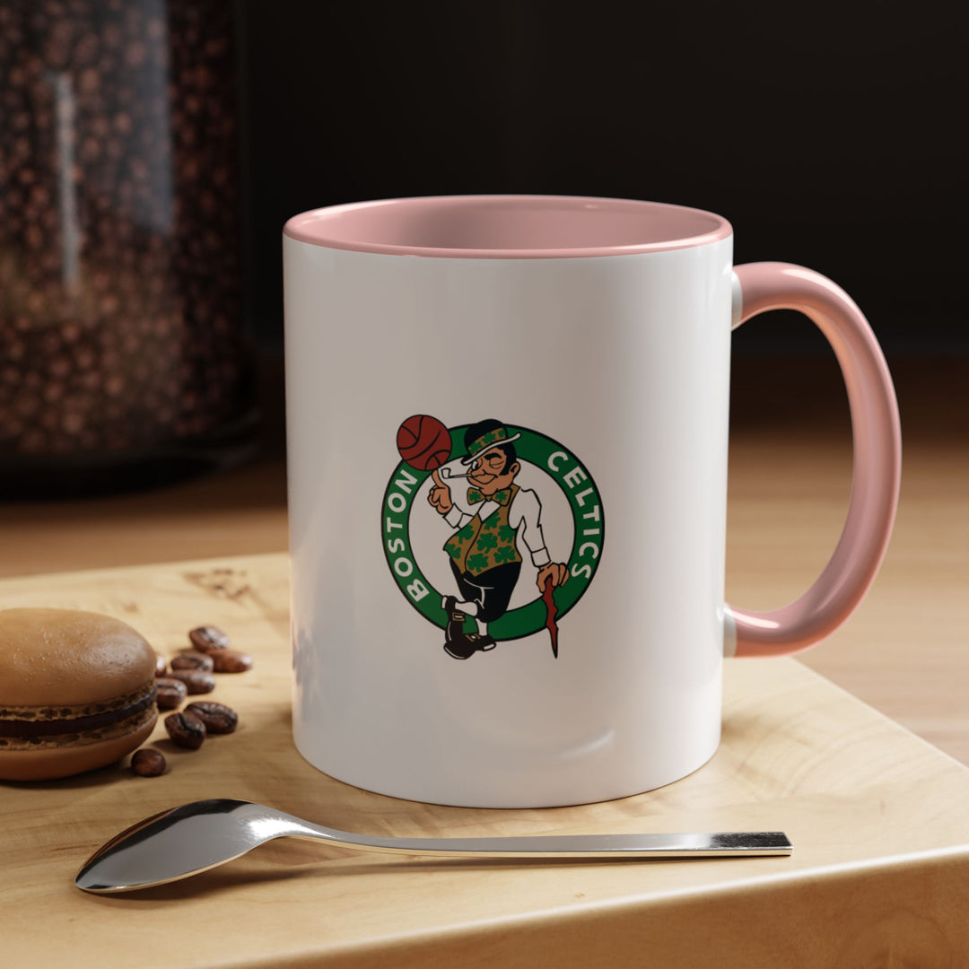 This pink Boston Celtics ceramic mug is playful and fun, designed for fans who want a unique way to enjoy coffee, tea, or hot chocolate. Its sturdy construction and stylish design make it ideal for daily use, collecting, or gifting. Celebrate your Celtics fandom while sipping your favorite warm beverage with this vibrant mug.