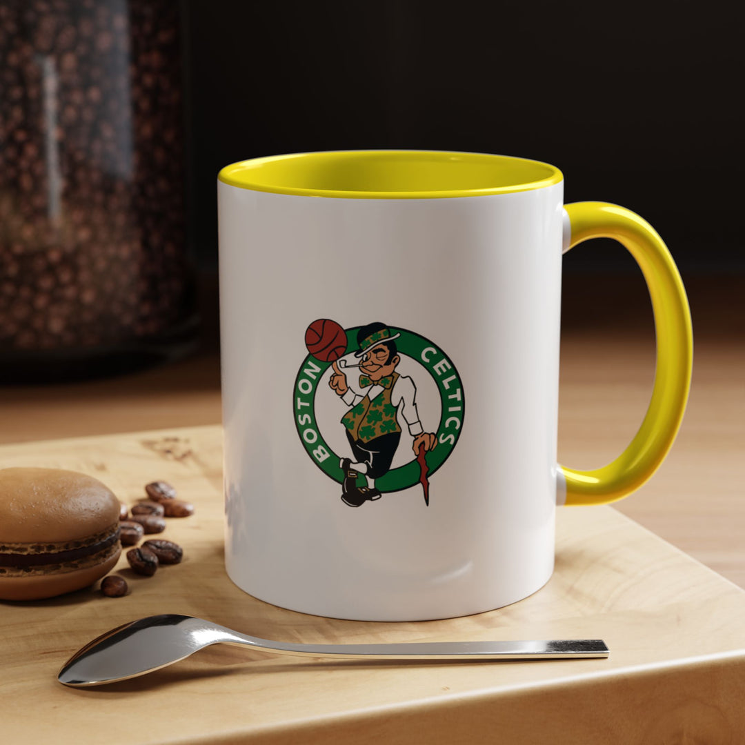 Bright yellow Boston Celtics mug crafted from ceramic, perfect for fans who want a cheerful and expressive drinkware piece. Its bold, eye-catching design combines durability with functionality, making it ideal for coffee, tea, or hot chocolate at home, office, or during game-day gatherings. A thoughtful gift for NBA supporters.