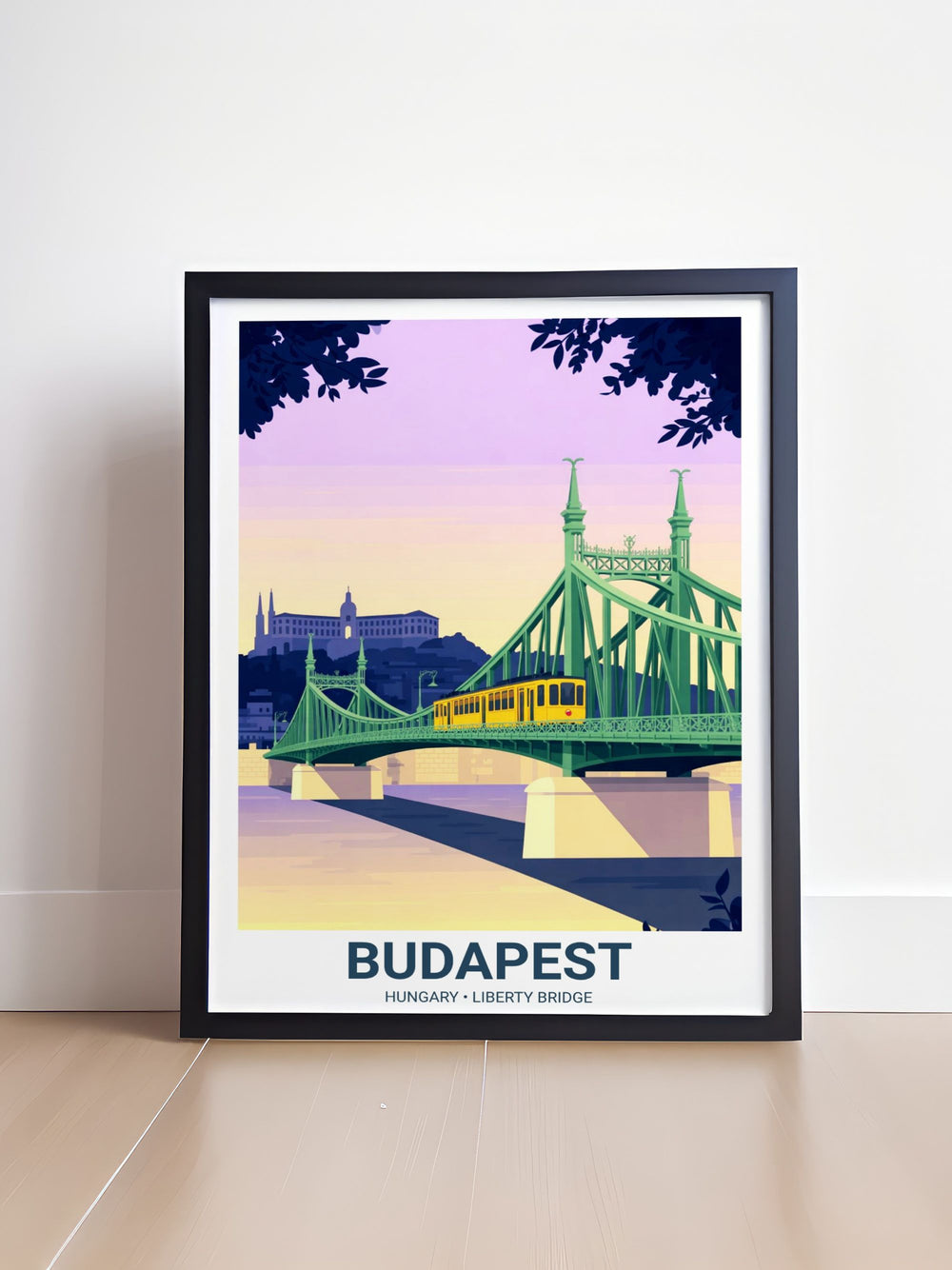 View of the mint green Liberty Bridge ironwork spanning the Danube. The silhouette of the Hotel Gellert stands against a lavender twilight sky with soft peach horizon glows.