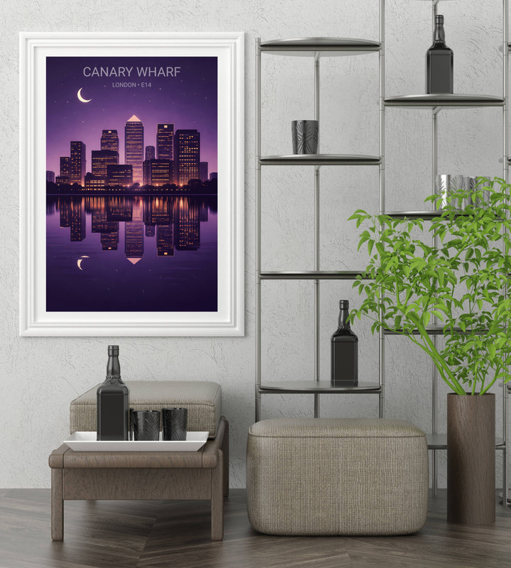 Framed canvas art of the London Docklands and Canary Wharf E14 skyline under a clear night sky with a bright moon, highlighting the contemporary architecture and city lights in a minimalist style.