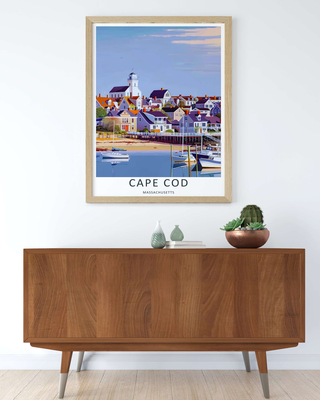 Cape Cod marina view behind a row of wooden docks with a white town cupola visible under a soft blue sky. A scenic nature poster from MapYourDreams, crafted expertly as an unframed print, wood-framed art, or canvas.