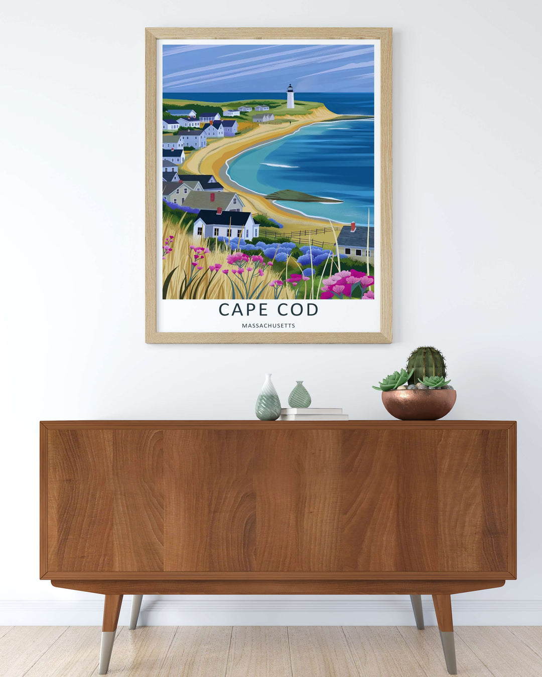 Cape Cod panoramic beach scene capturing a curved sandy coastline and clear blue ocean water from an elevated view. This poster makes great beach house wall art as a canvas, framed print, or poster.
