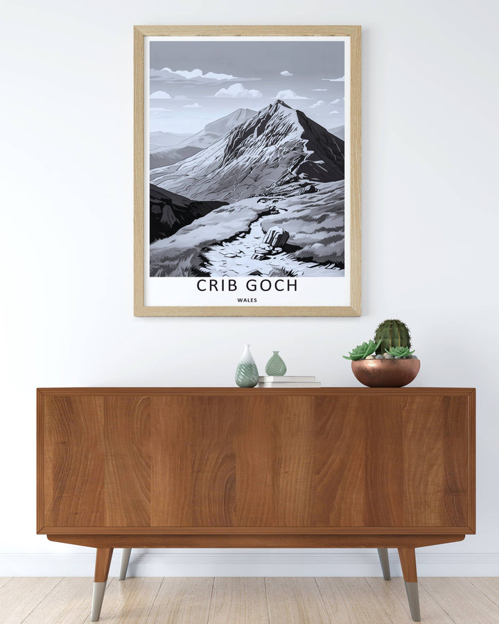 Radiant grayscale print celebrating Welsh geography with a sharp geometric perspective of the Crib Goch mountain ridge in Snowdonia, displayed on a wall within a rustic natural wood frame.