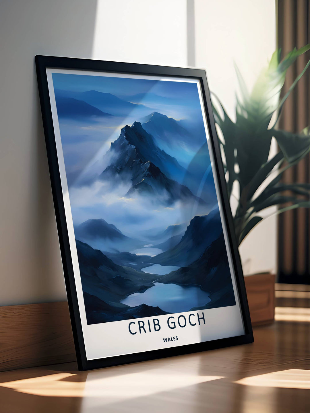 A beautiful mountain theme travel poster featuring the rugged peak and blue valley lakes of Crib Goch, available in flexible unframed, framed, or canvas print layouts. The illustration captures the expansive feeling of a moody, high-altitude ridge line.