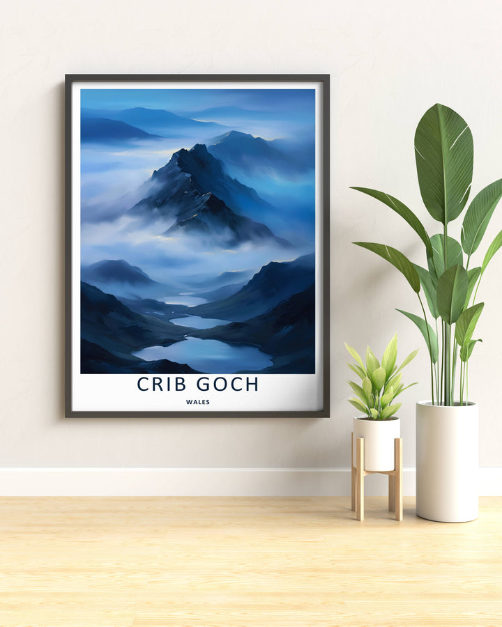 Modern travel poster art featuring a retro painterly layout of the classic Crib Goch mountain range, which can be ordered as a stretched canvas, an unframed poster, or a framed print. The landscape art details winding bodies of water under fog.