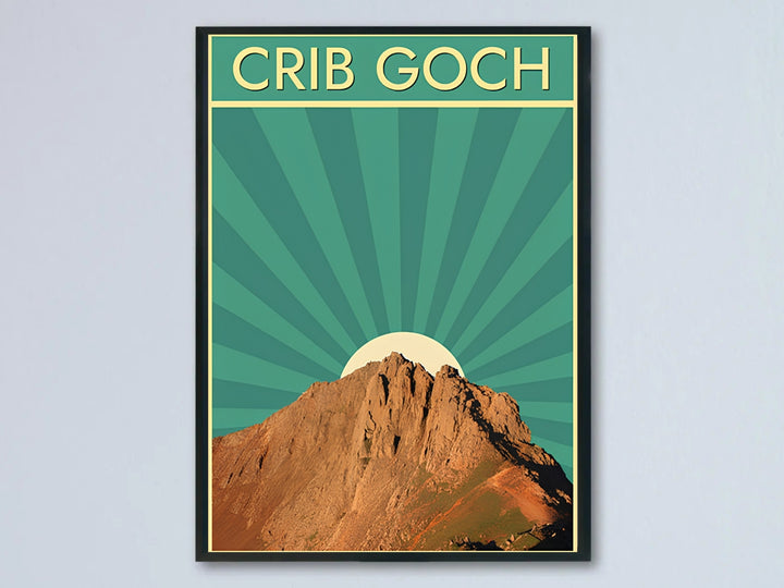 A retro travel poster of Crib Goch in Snowdonia, Wales, showcased against a light interior wall; this artwork is available as an unframed print, a stylish canvas, or a framed print option. The graphic art features a prominent cream sunburst behind a realistic, rugged brown mountain peak under bold vintage typography.