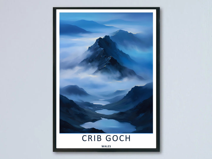 A retro travel poster featuring the atmospheric mountain landscape of Crib Goch; this artwork is available as an unframed print, a premium canvas, or a framed print option. The graphic art showcases a dark peak rising above a moody sea of low valley mist.