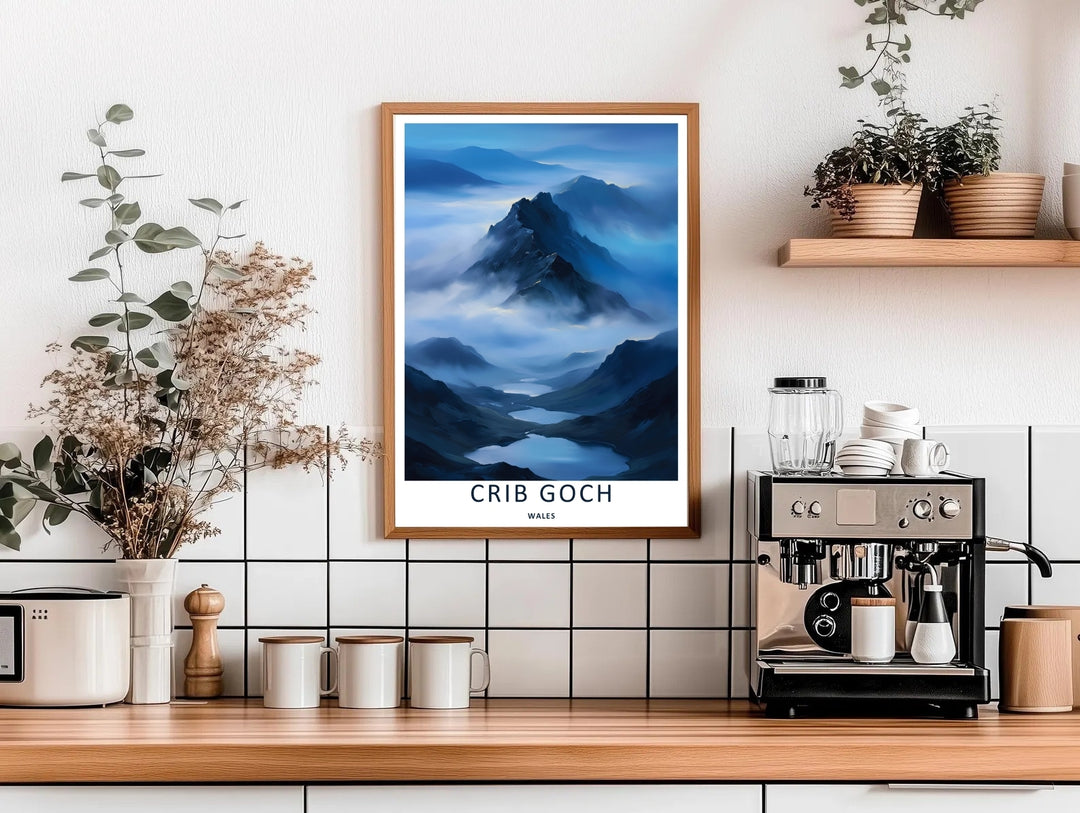 High-contrast illustrative artwork of the cloud-covered Crib Goch mountain trail, custom made as a canvas, a standalone unframed print, or a framed poster. The design uses layered textures and dark blue tones to show a scenic mountain peak.