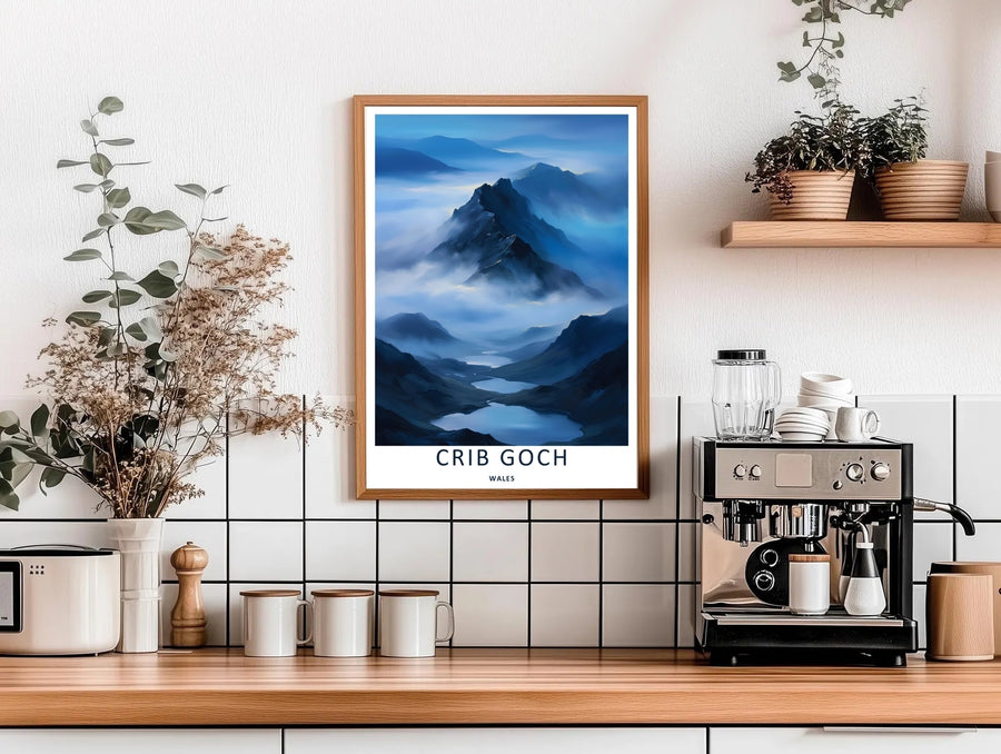 High-contrast illustrative artwork of the cloud-covered Crib Goch mountain trail, custom made as a canvas, a standalone unframed print, or a framed poster. The design uses layered textures and dark blue tones to show a scenic mountain peak.