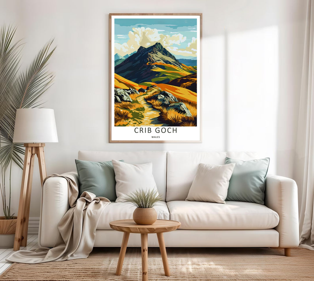 A colorful travel poster design of the scenic Crib Goch mountain peak, available in a variety of presentation formats including unframed prints, canvas wall art, and framed finishes. The print highlights the golden grass fields stretching below the steep ridge.