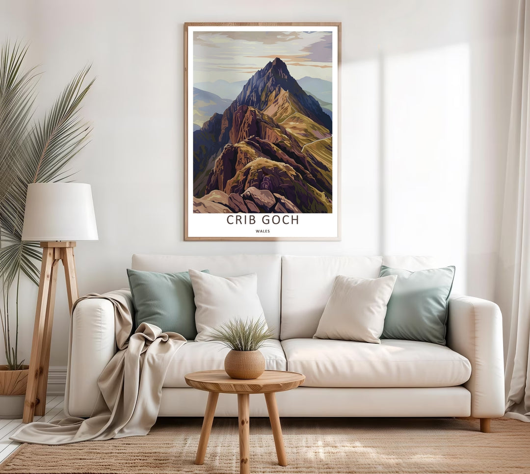 Radiant warm-toned print celebrating Welsh geography with a sharp geometric perspective of the Crib Goch mountain ridge in Snowdonia, displayed on a wall within a rustic natural wood frame.