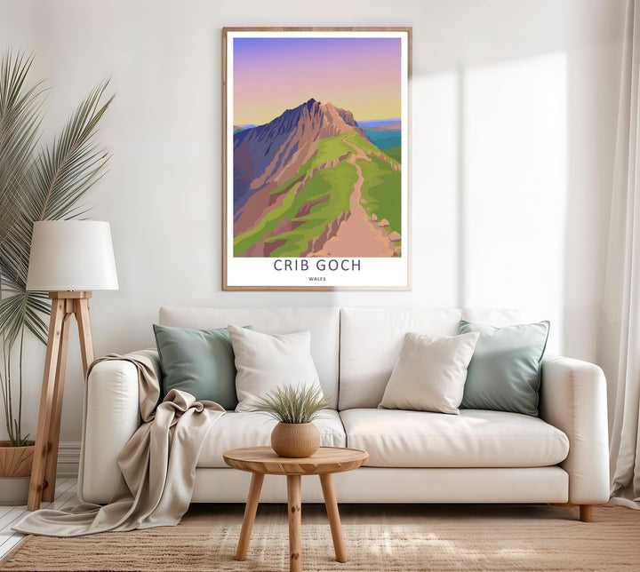 A colorful travel poster design of the scenic Crib Goch mountain peak, available in a variety of presentation formats including unframed prints, canvas wall art, and framed finishes. The print highlights a path stretching below a purple and orange sky.