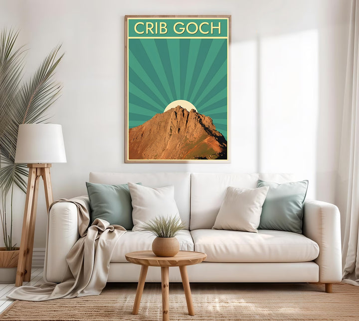 A rustic style print displaying a vintage Crib Goch travel poster, with flexible options to purchase as an unframed print, a high-quality canvas, or a framed display. The design honors the Snowdonia, Wales landscape with a beautiful blend of highly detailed mountain photography and retro art deco sunburst rays.