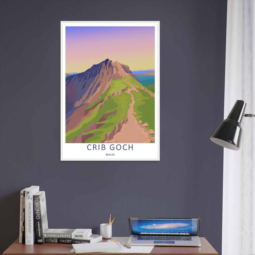 A vintage style landscape art print displaying the beautiful sunset view of the Crib Goch mountain ridge, offered as a canvas, an unframed poster, or within a framed display. The layout highlights smooth pastel gradients and green paths.