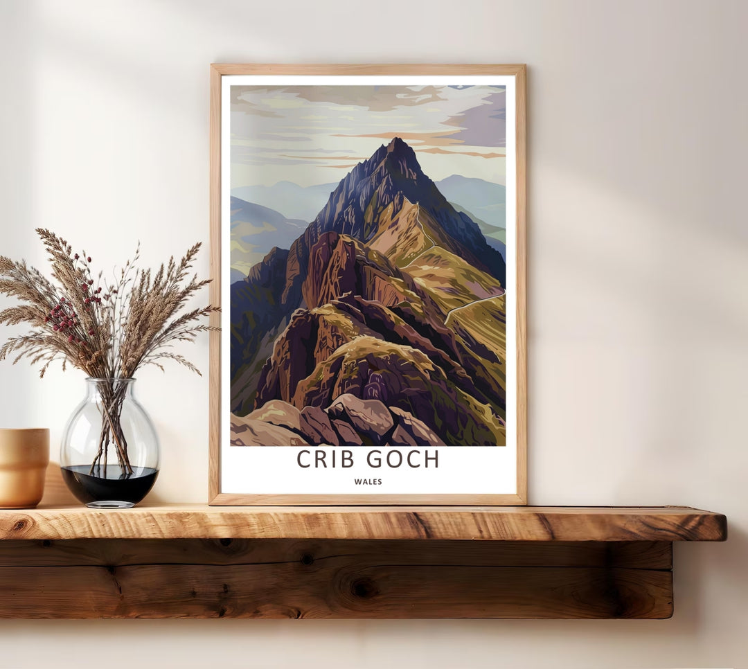 Muted brown nature wall decor showing the towering mountain silhouette of Crib Goch in Wales under a soft hazy sky, presented inside a classic white frame to elevate a modern living room gallery.