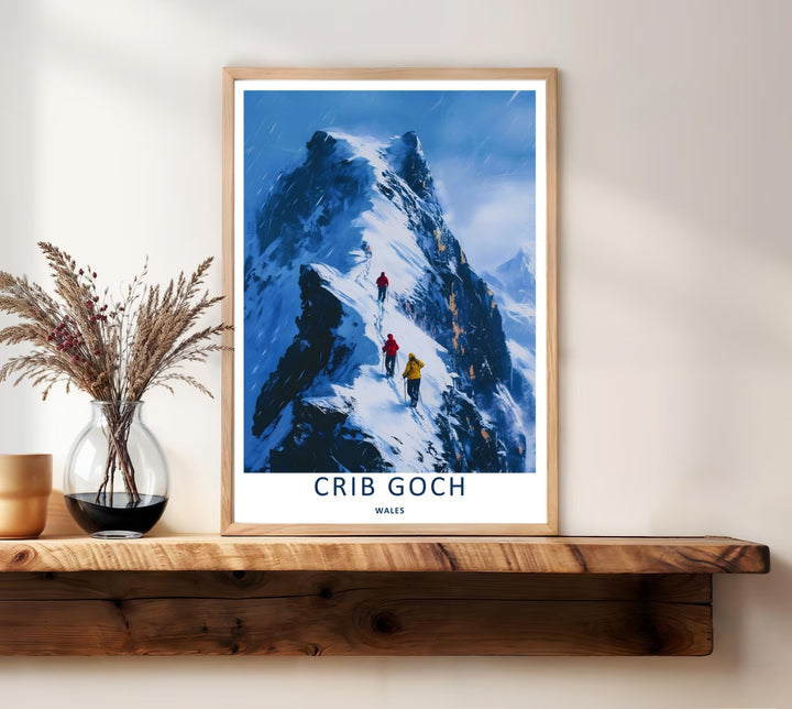 A stylized landscape print displaying a vintage Crib Goch winter mountain travel poster, with options to purchase as an unframed print, a high-quality canvas, or a framed display. The artwork balances cold dark blue slopes against pristine white snow.