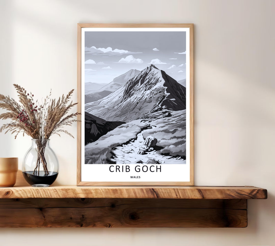 Richly detailed black and white nature wall decor showing the soaring summit of Crib Goch in Wales under a detailed cloud sky, presented inside a classic white frame to elevate modern home styling.