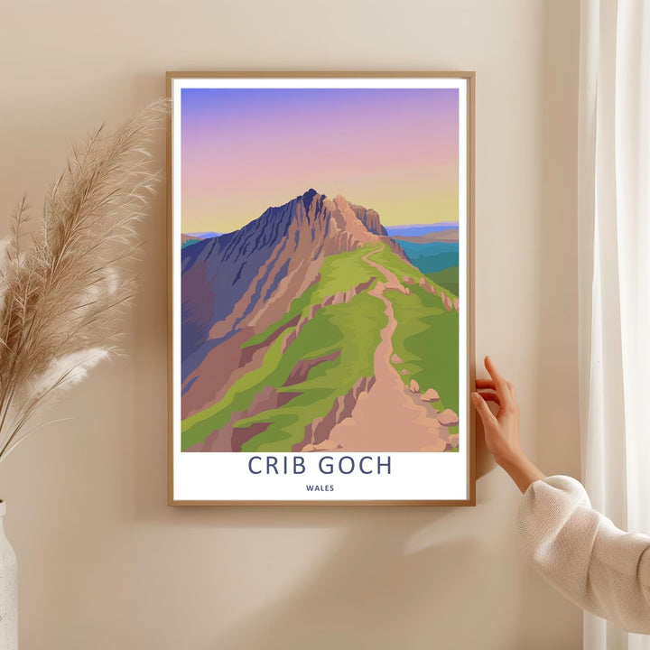 High-quality travel poster artwork showing a stylized Crib Goch mountain hiking path illustration, purchasable as canvas wall art, an unframed print, or a framed art piece. The print captures the clean geometric lines of a ridge trail at twilight.