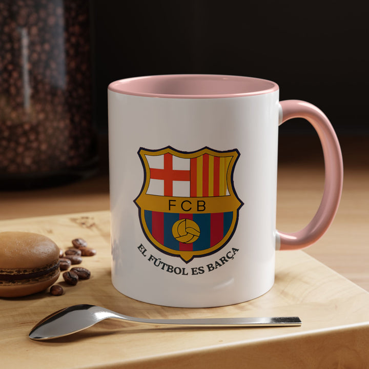 A unique pink FC Barcelona fan mug with the official crest, offering a modern and stylish take on classic supporter merchandise. Great for coffee lovers, tea drinkers, and collectors. Comfortable to hold and visually striking, it brings warmth, personality, and club pride to your daily drink moments.