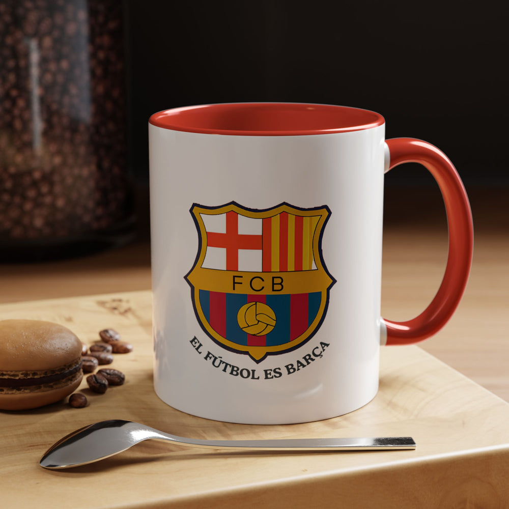 This FC Barcelona coffee mug in vibrant red features the club’s official crest printed boldly on the side. Designed for fans who enjoy expressing their passion through daily routines, it’s perfect for coffee, tea, or hot chocolate. The ceramic build offers durability and comfort, making it an ideal addition to any supporter’s collection at home or in the office.