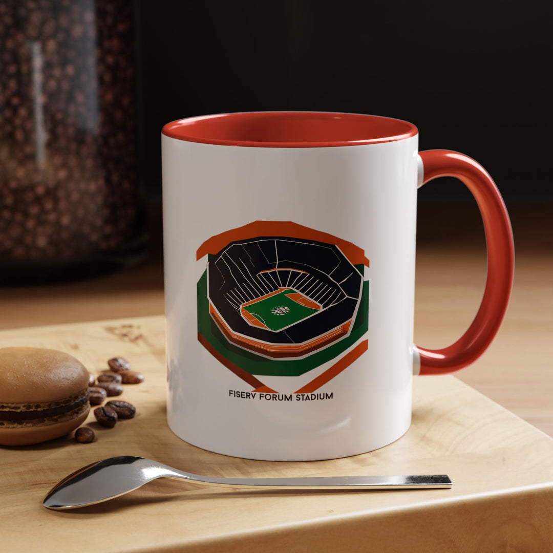 A red ceramic mug featuring a detailed artistic depiction of Fiserv Forum, home of the Milwaukee Bucks. Perfect for fans who love connecting their daily coffee or tea routine with team pride and the electric atmosphere of The Deer District. Durable, smooth to hold, and ideal for collectors or everyday supporters of Milwaukee basketball.