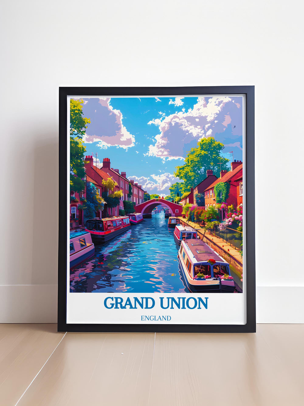 Picturesque scene of a sunny day in Little Venice, London showing colorful narrowboats lined along the tranquil Grand Union Canal.