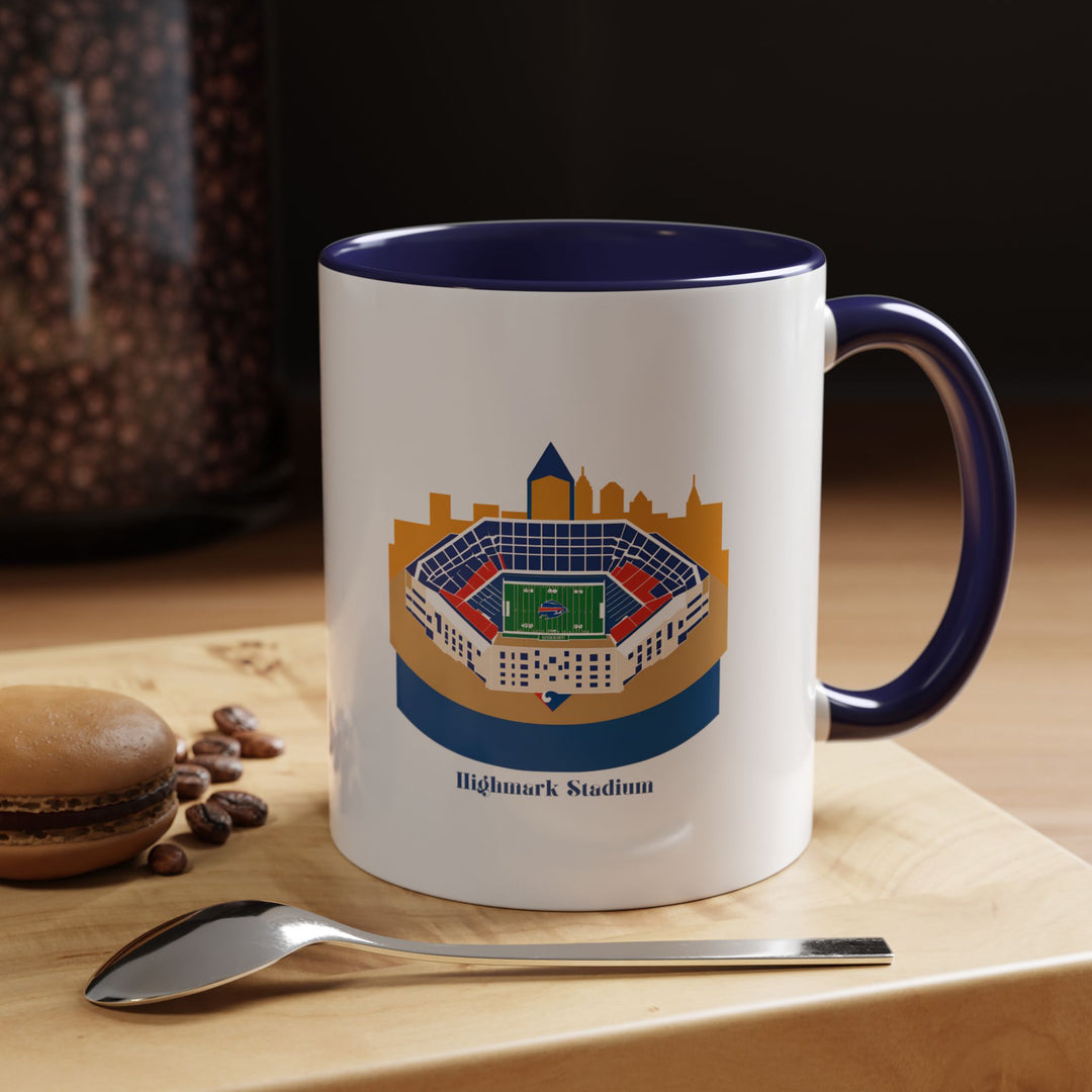 Navy Blue Highmark Stadium Mug showcasing a detailed stadium illustration that blends seamlessly with the deep blue ceramic finish, creating a strong, classic fan aesthetic. Perfect for morning brews or evening tea, this mug is pictured on a work desk, symbolizing how Buffalo Bills fans proudly incorporate team loyalty into both professional and personal settings.