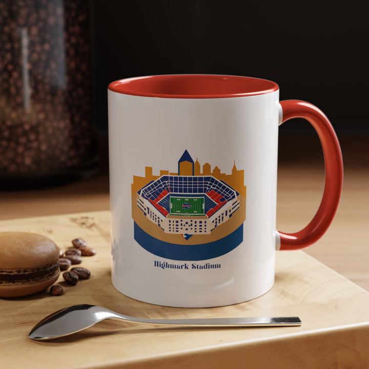 Red Highmark Stadium Mug with a vividly printed stadium panorama standing out against the bright ceramic background, offering a bold and energetic look for fans. Shown alongside a steaming coffee, this mug reflects the excitement and passion of Buffalo football culture, making it a standout collectible or daily-use drinkware piece for enthusiastic supporters.